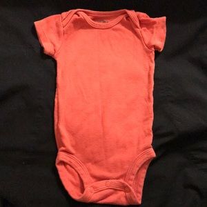 Brick red onesie